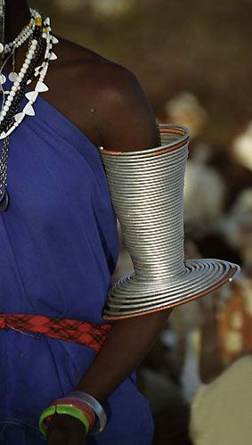 Africa | Traditional Masai or Ndoroba bangle on woman's arm. Tanzania | ©Biophoto 